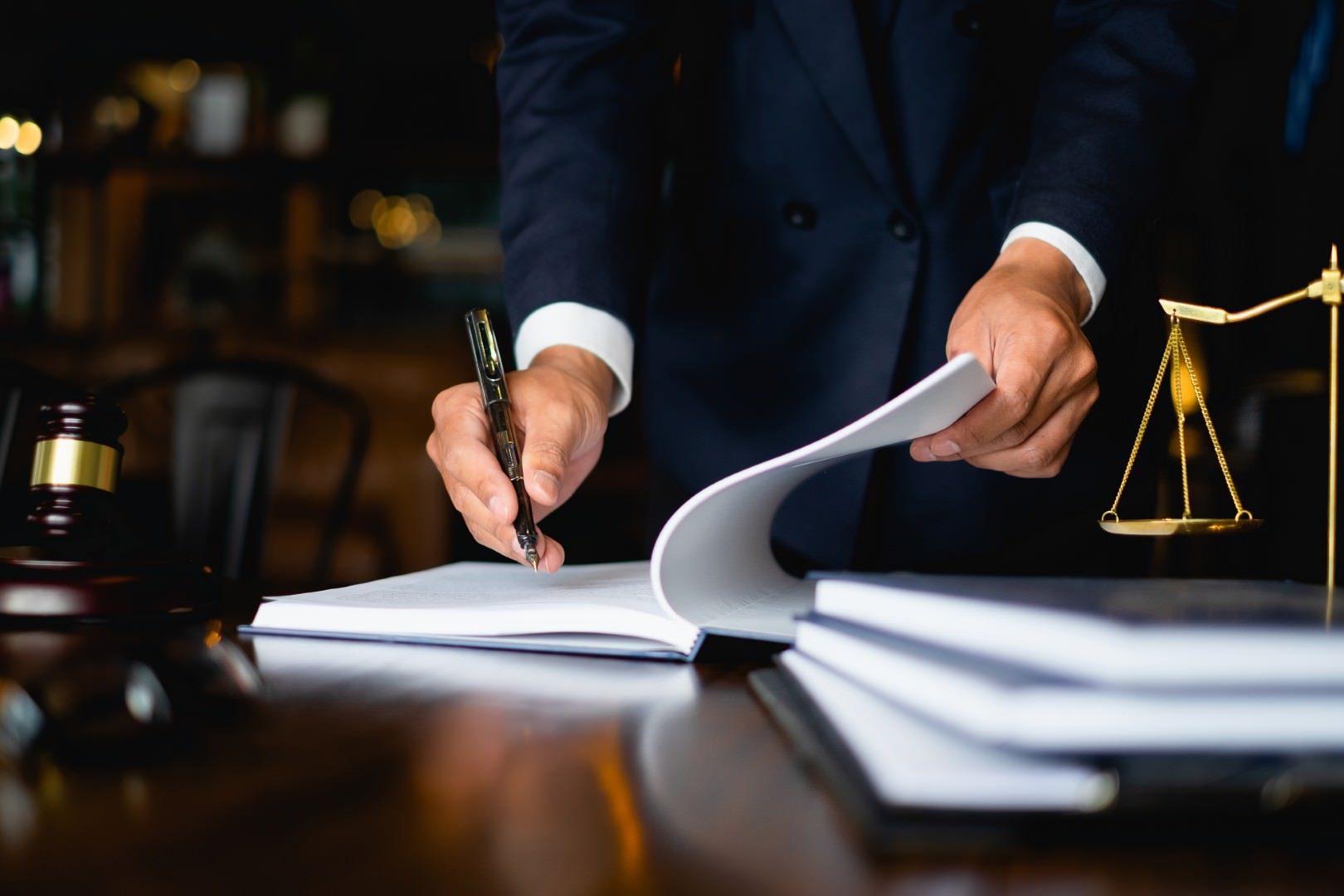 San Diego business formation attorney reviewing entity documents at his desk