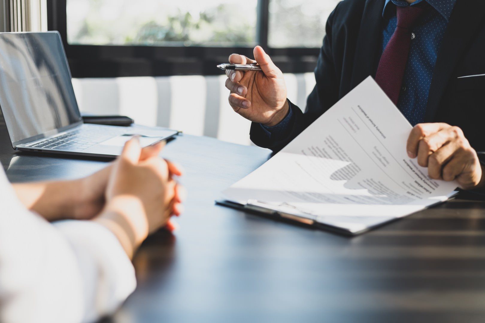 Investor and attorney discussing a distressed loan purchase file
